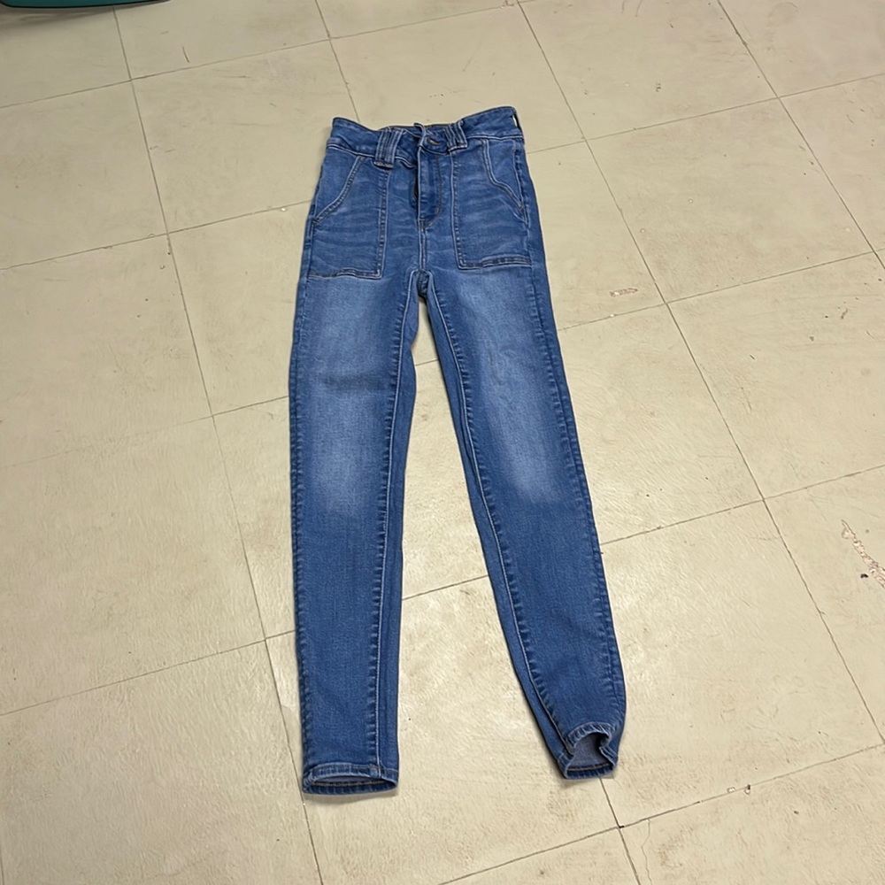 Bundle of clothes with brands American Eagle and a new day. jeans has stain